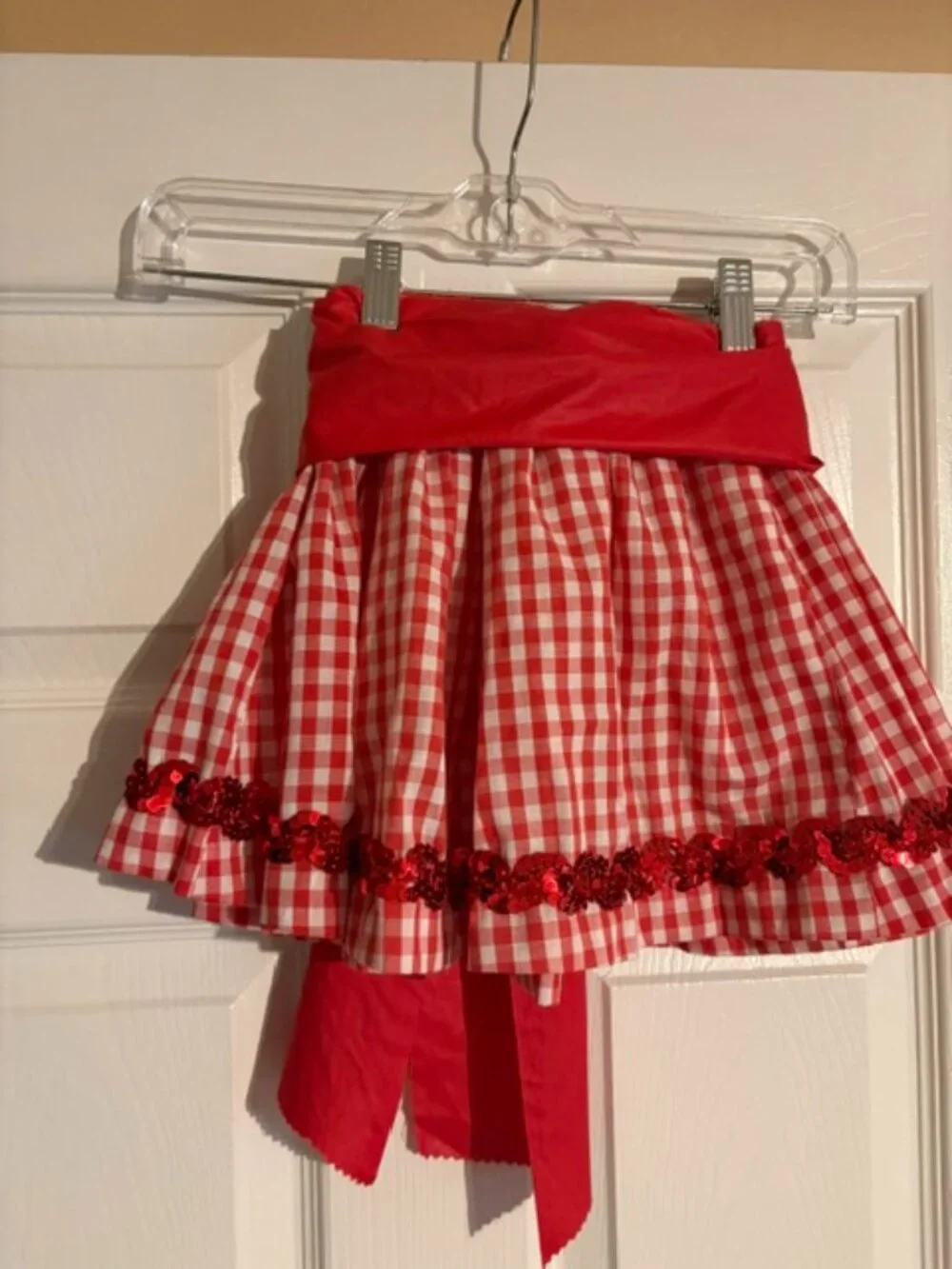 Eight Red Country Recital Skirts with Sashes